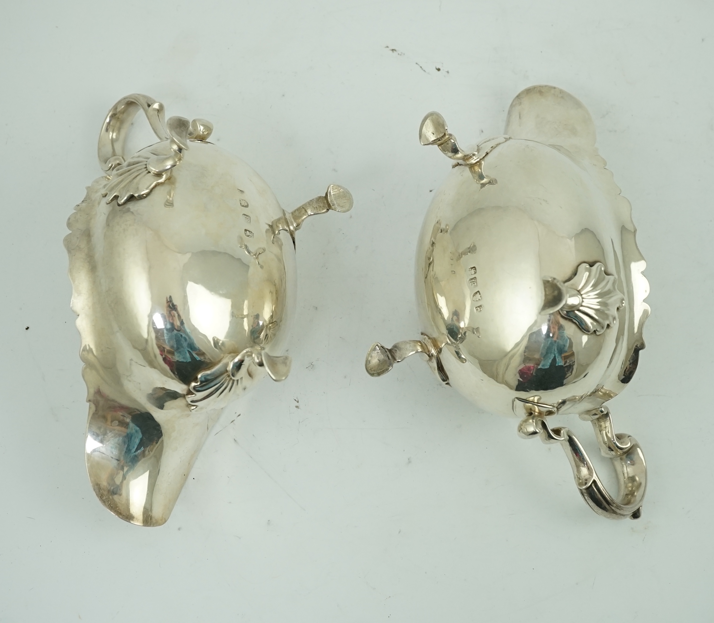 A pair of late George II silver sauceboats by Robert Albin Cox